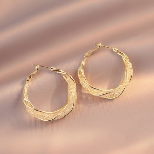 Stylish Gold Hoop Earrings with a Unique Twist Design
