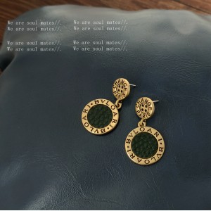 Striking Gold Drop Earrings with Roman Numerals